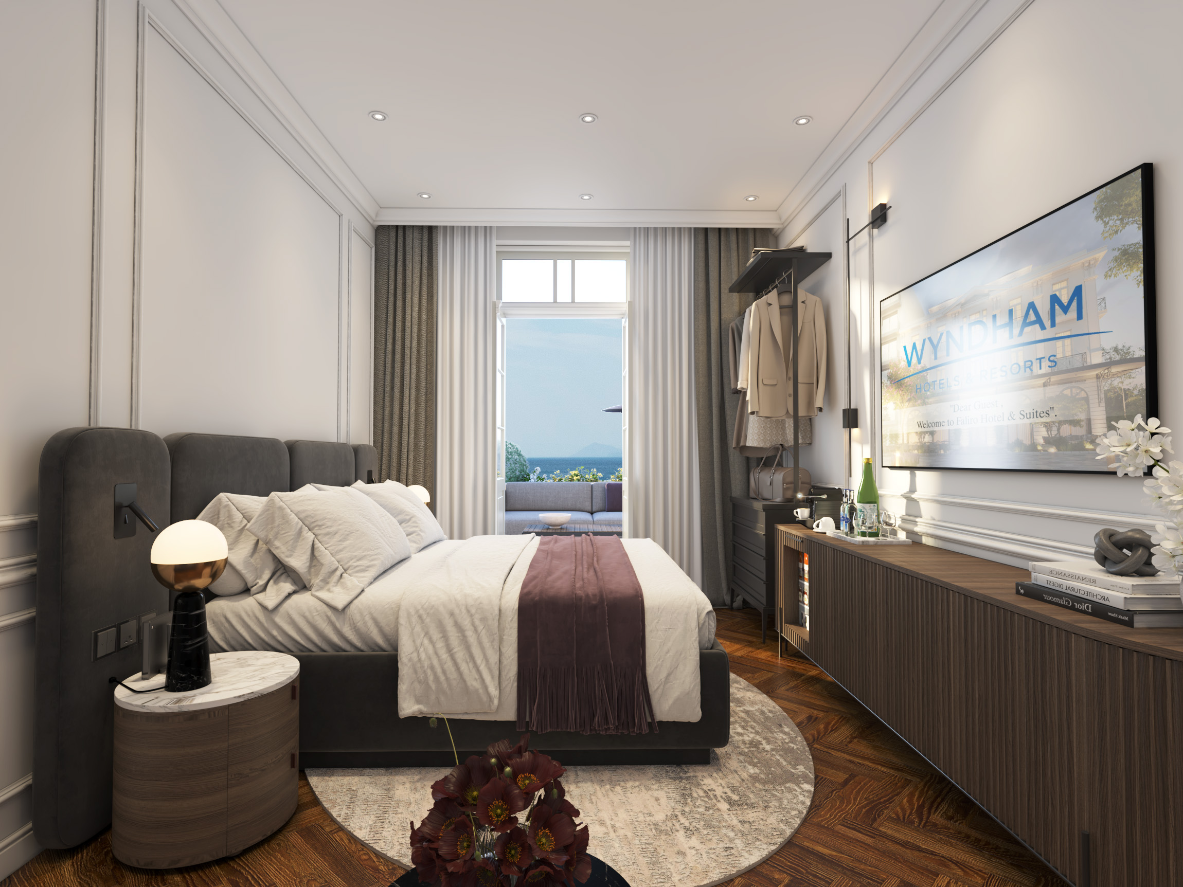 Elegant hotel suite bedroom with sea view and Wyndham branding